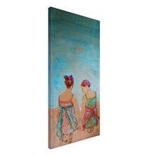 Load image into Gallery viewer, Beloved – canvas print by Mehlika Tanriverdi, showing two women sitting side by side in quiet connection, with floral dresses and flower crowns, on a soft blue and earth-toned background, evoking sisterhood and soulful presence