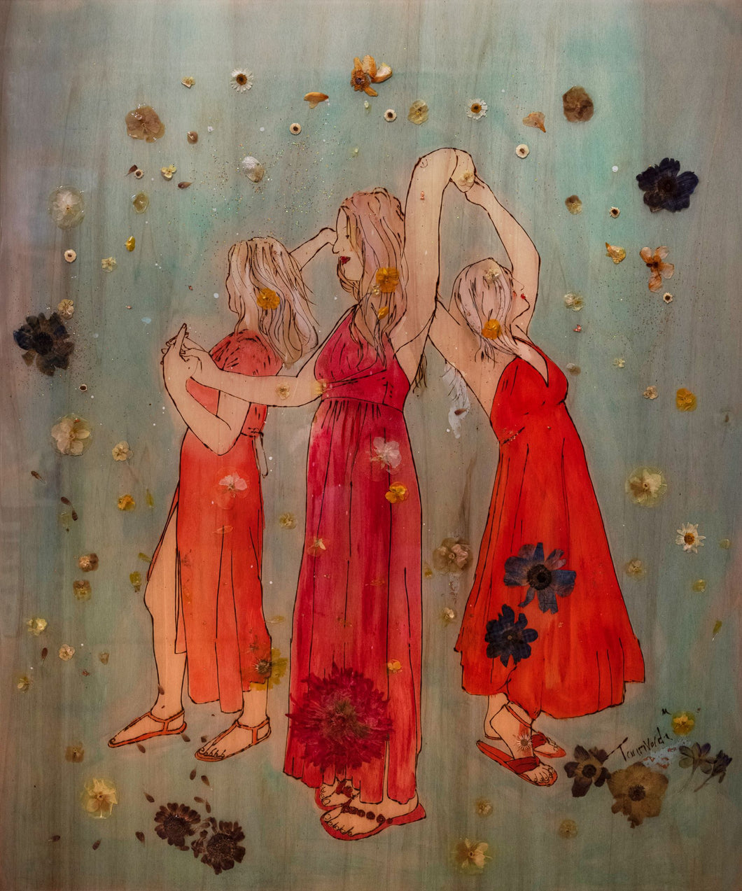 Three women in flowing red dresses dancing in celebration on a wooden artwork by Mehlika Tanriverdi, with pressed blossoms and resin embedded in the surface, radiating joy and midsummer energy.