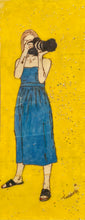 Load image into Gallery viewer, Ready Or Not… Here I Come – original artwork on wood by Mehlika Tanriverdi, showing a woman with a camera on a bright yellow background, symbolizing awareness, confidence, and playful visibility.
